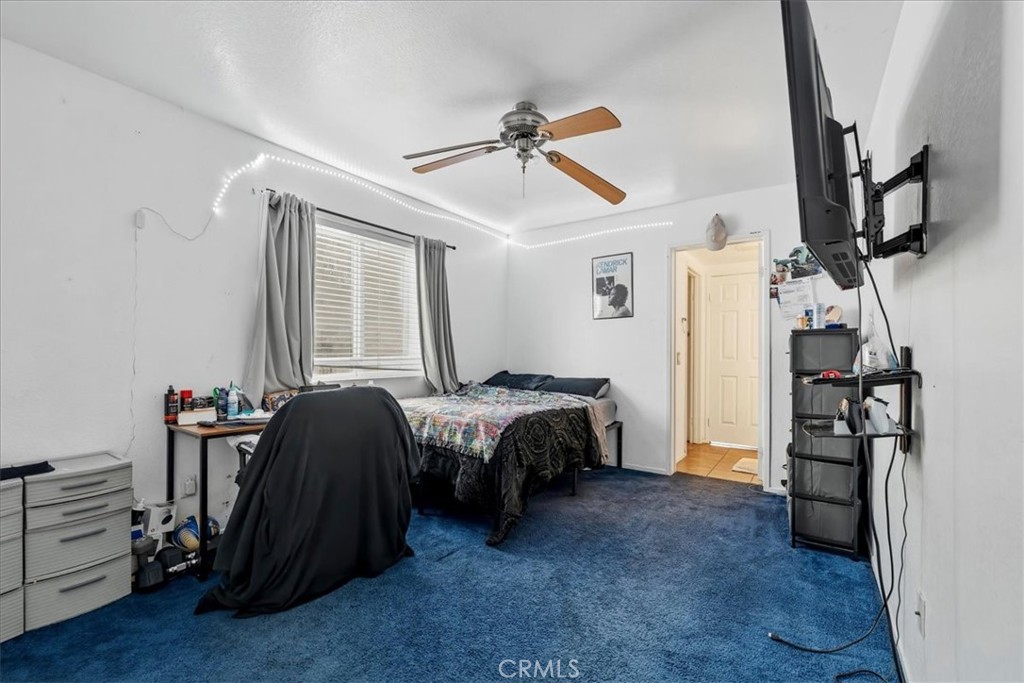 16220 Vía Ultimo Moreno Valley, CA 92551 - Photo 26 of 38 a bed room with a bed and a window