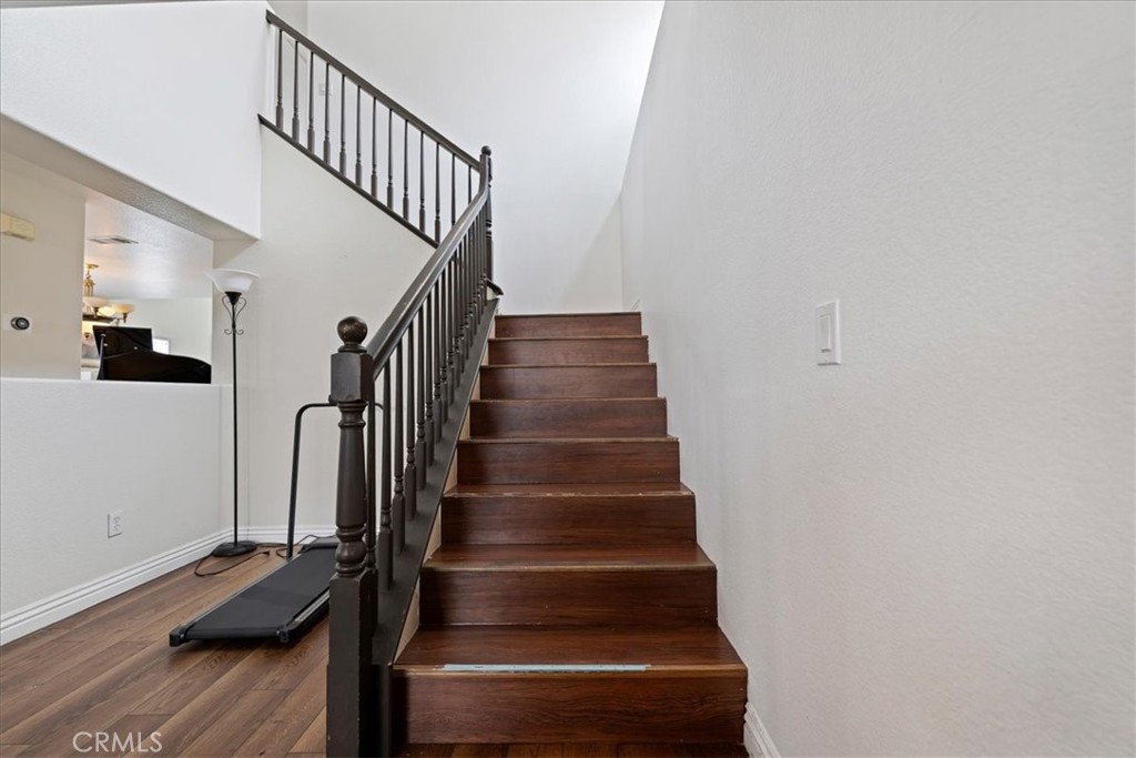 16220 Vía Ultimo Moreno Valley, CA 92551 - Photo 27 of 38 a view of entryway and hall with wooden floor