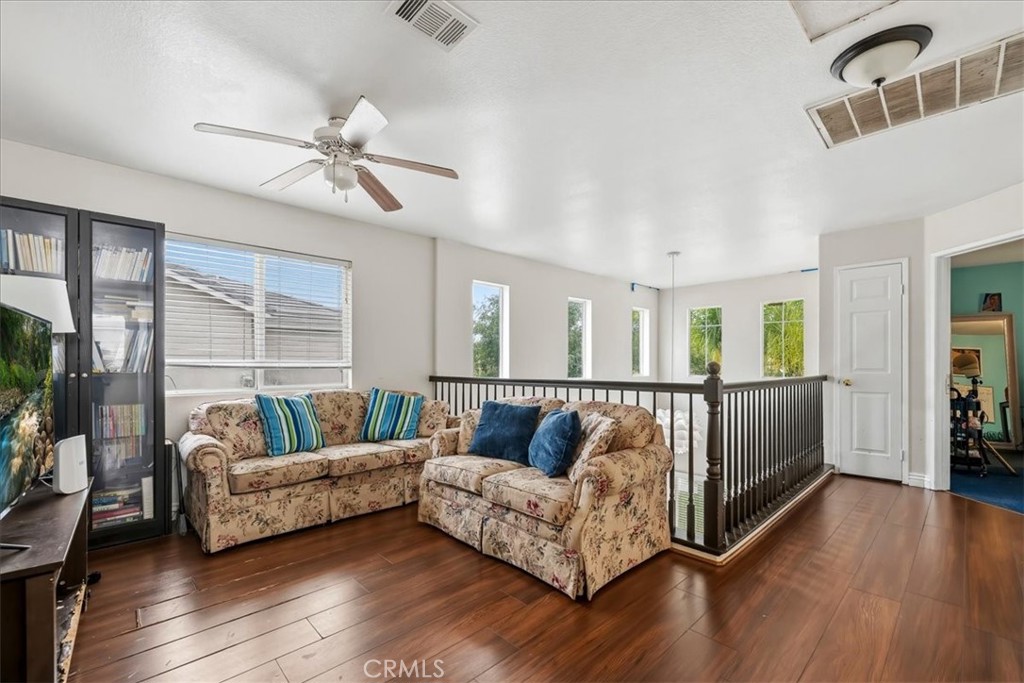 16220 Vía Ultimo Moreno Valley, CA 92551 - Photo 28 of 38 a living room with furniture and a large window