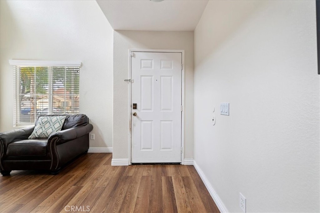 16220 Vía Ultimo Moreno Valley, CA 92551 - Photo 5 of 38 a living room with furniture and a window