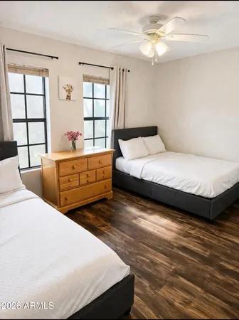 a living room with bed and window