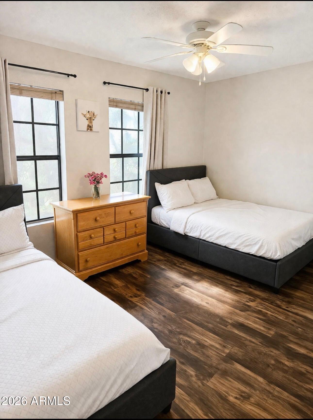 4835 East McNeil Street, Unit 2 Phoenix, AZ 85044 - Photo 11 of 21 a living room with bed and window