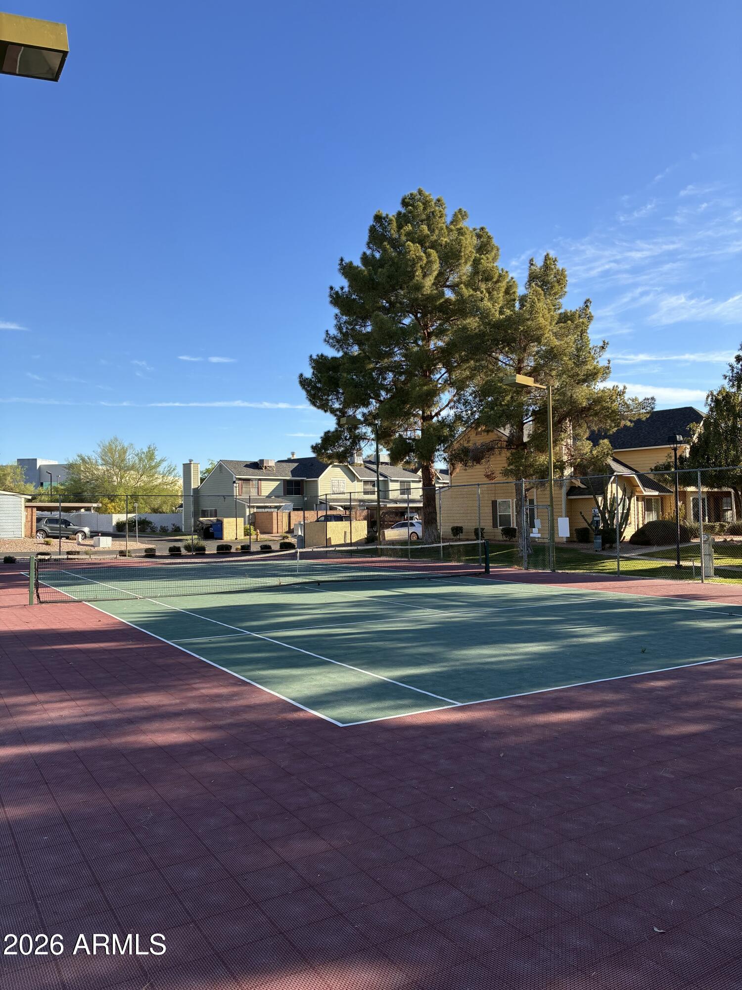 4835 East McNeil Street, Unit 2 Phoenix, AZ 85044 - Photo 17 of 21 a green field with lots of trees in the background