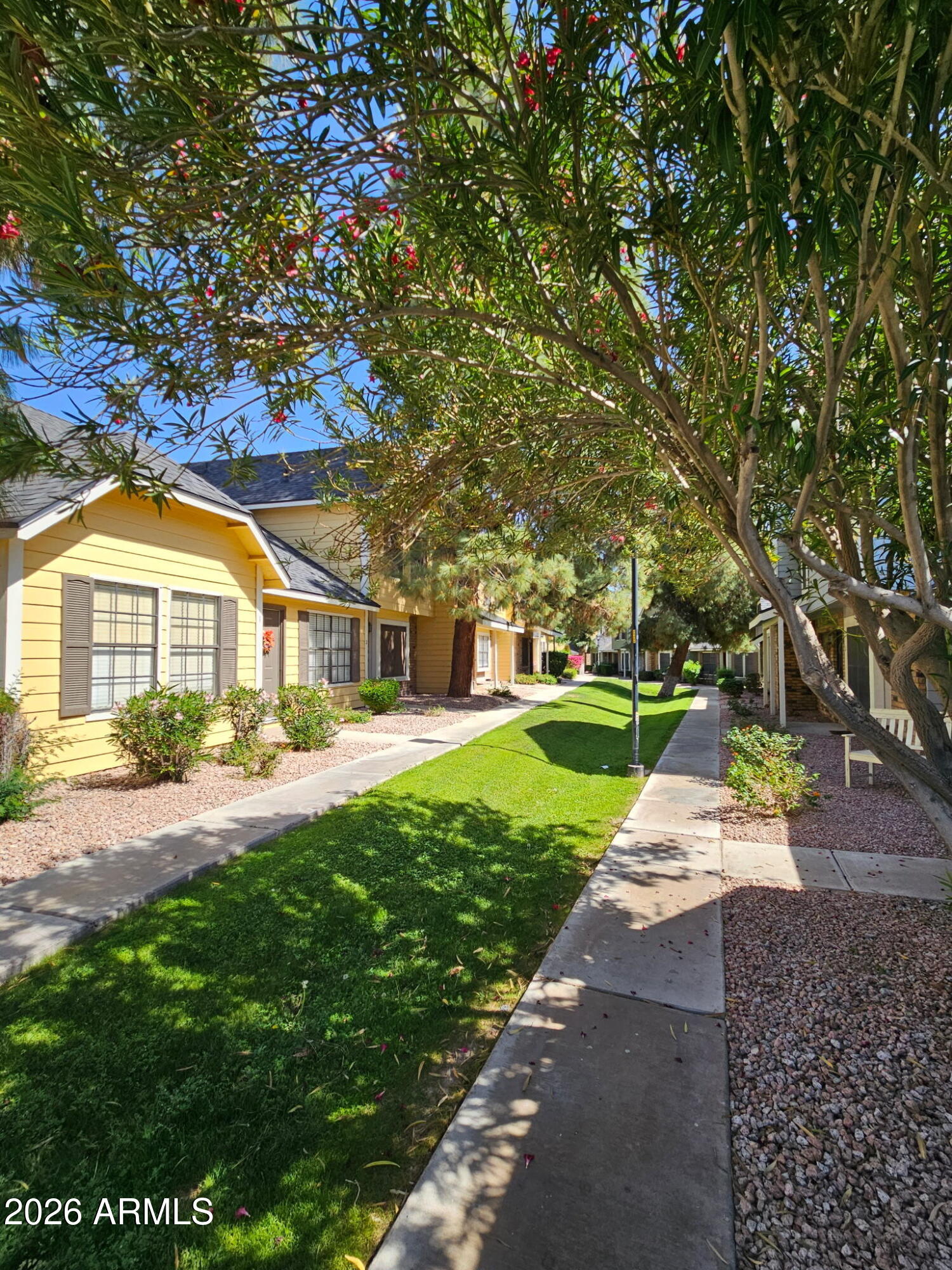 4835 East McNeil Street, Unit 2 Phoenix, AZ 85044 - Photo 19 of 21 a front view of house with yard