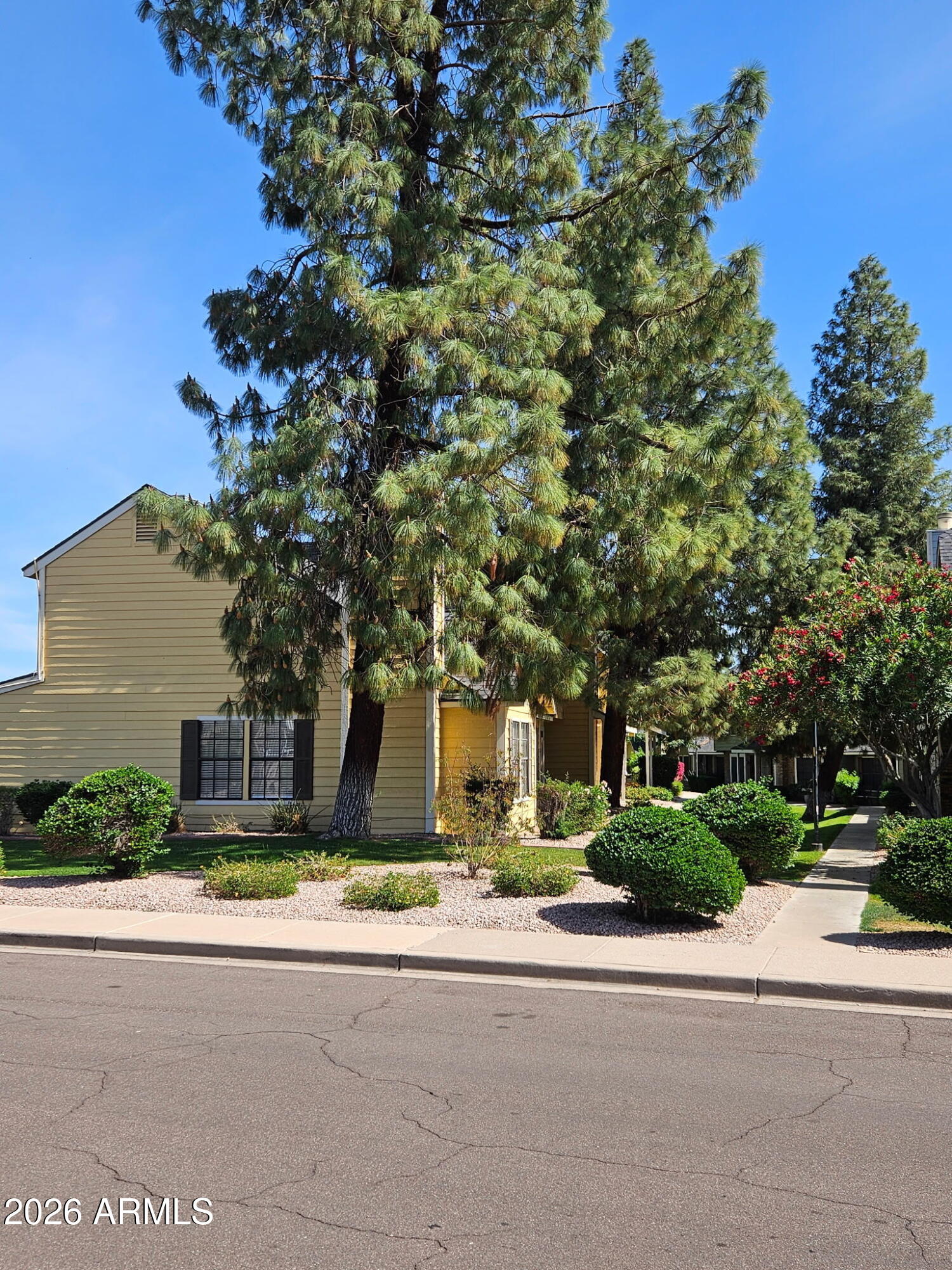 4835 East McNeil Street, Unit 2 Phoenix, AZ 85044 - Photo 20 of 21 front view of a house with a street