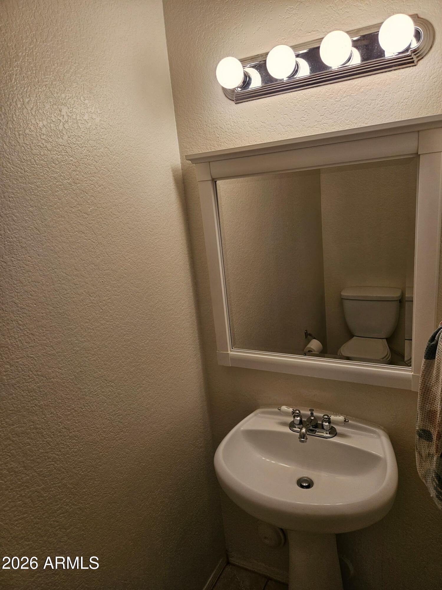4835 East McNeil Street, Unit 2 Phoenix, AZ 85044 - Photo 6 of 21 a bathroom with a sink and a mirror