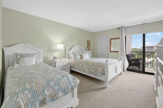 a bedroom with a large bed and a large window