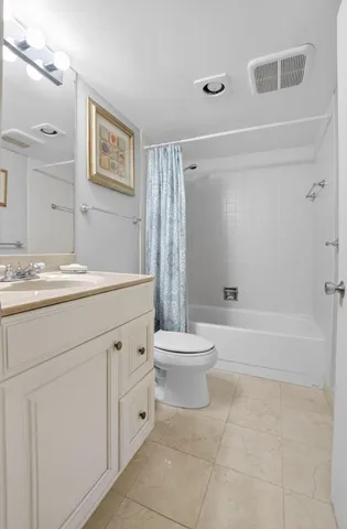 a bathroom with a sink a toilet and a bathtub