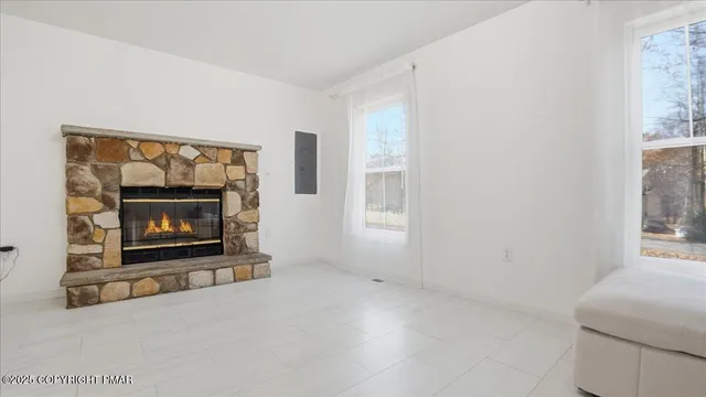 a living room with furniture and white walls