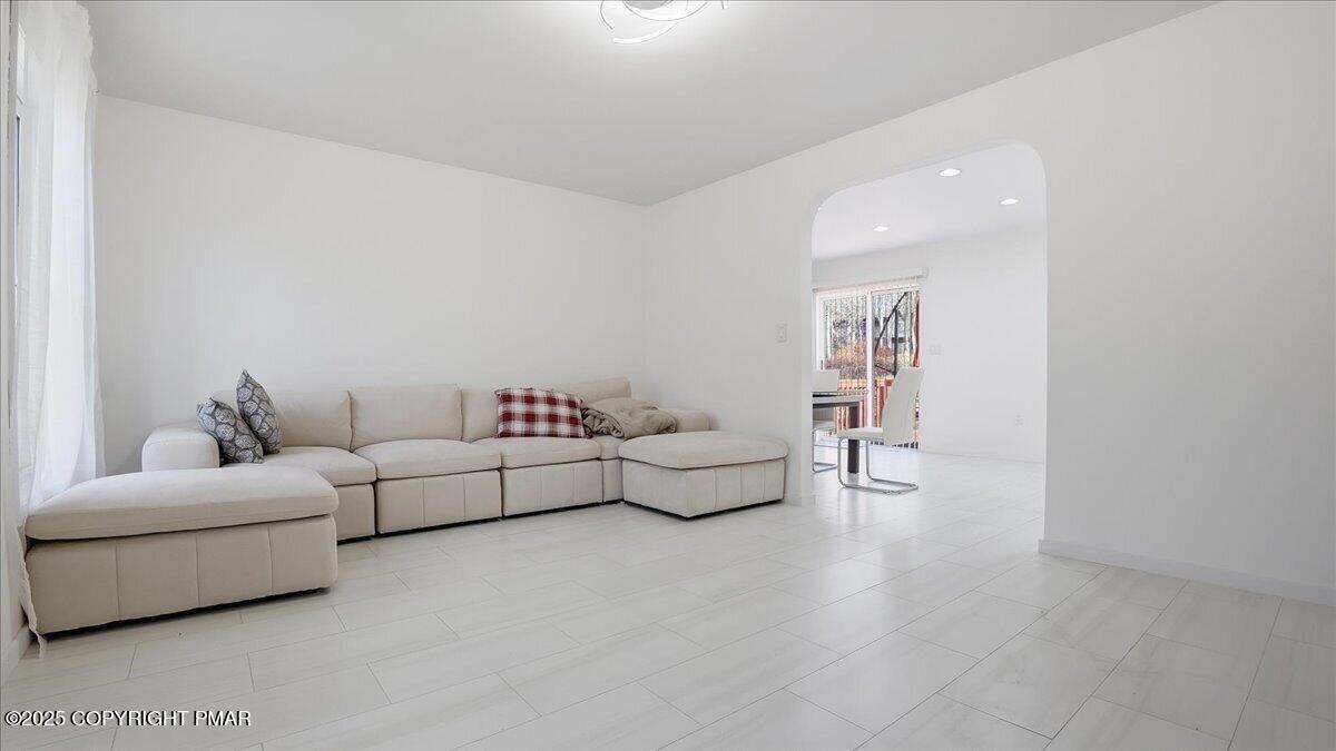 2312 Cramer Court Bushkill, PA 18324 - Photo 15 of 107 a living room with furniture and white walls