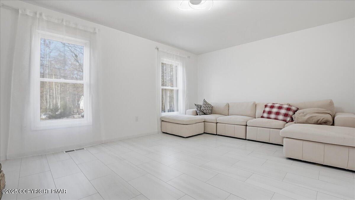 2312 Cramer Court Bushkill, PA 18324 - Photo 16 of 107 a living room with furniture and a window