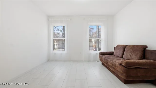 a kitchen with stainless steel appliances a refrigerator sink and microwave