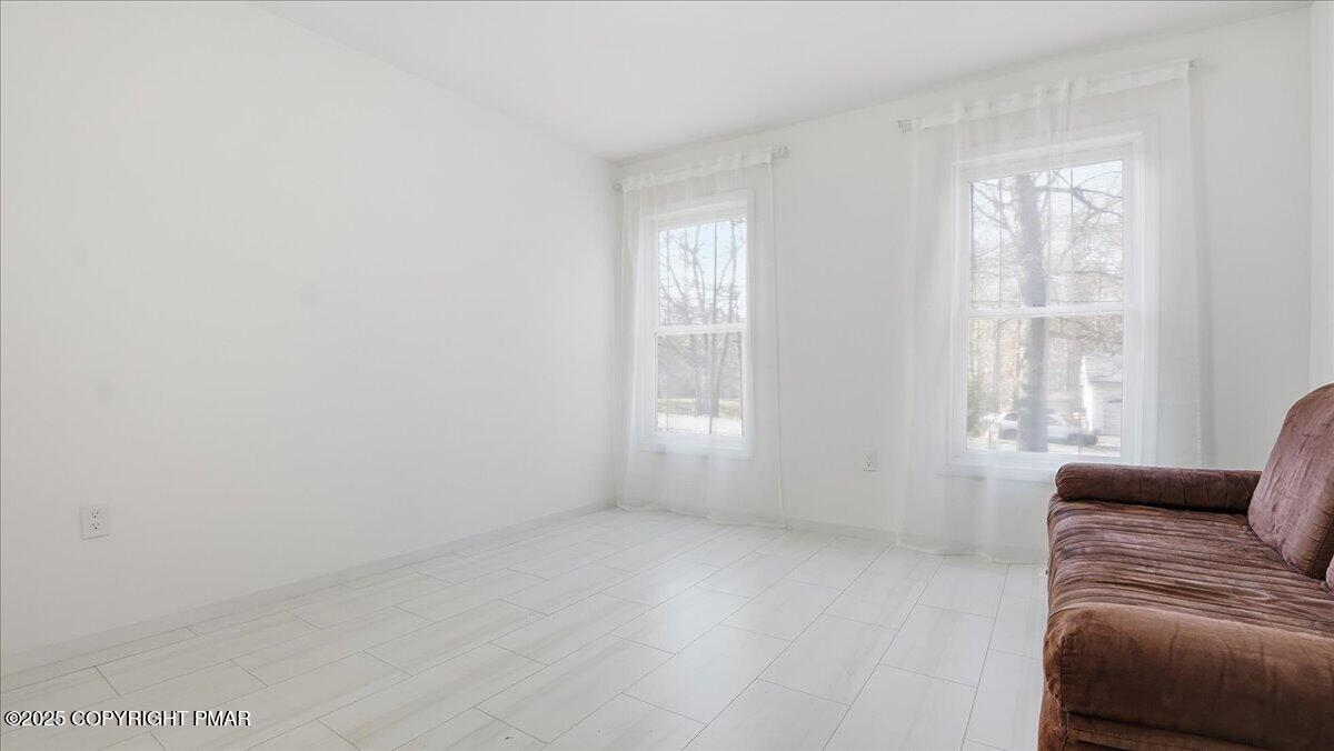 2312 Cramer Court Bushkill, PA 18324 - Photo 19 of 107 a living room with furniture and a window