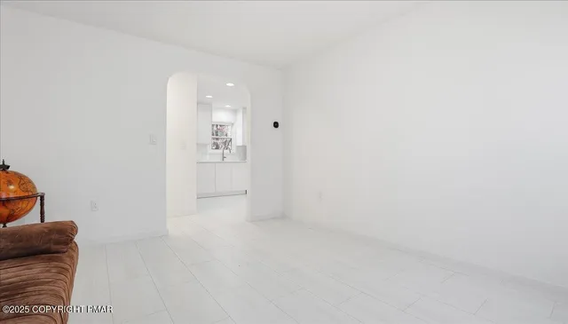 a kitchen with stainless steel appliances a refrigerator sink and stove