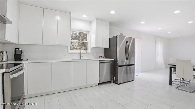 a view of a livingroom with furniture and a table