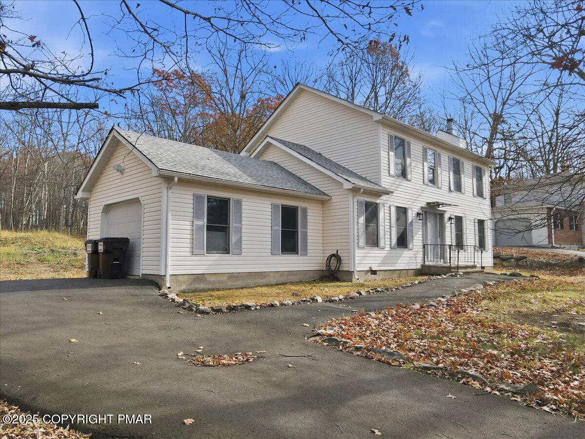 2312 Cramer Court Bushkill, PA 18324 - Photo 3 of 107 a front view of a house with a garden