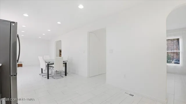 a view of a backyard with a large trees