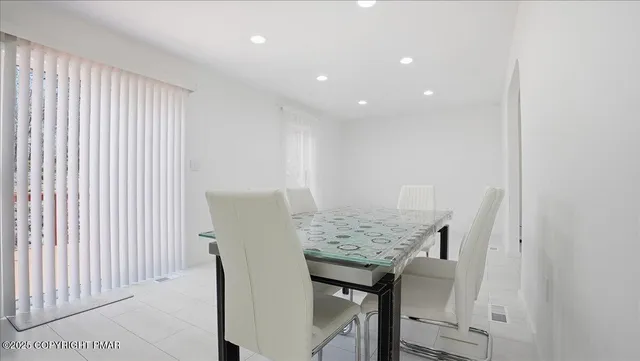 a view of a house with a yard and deck