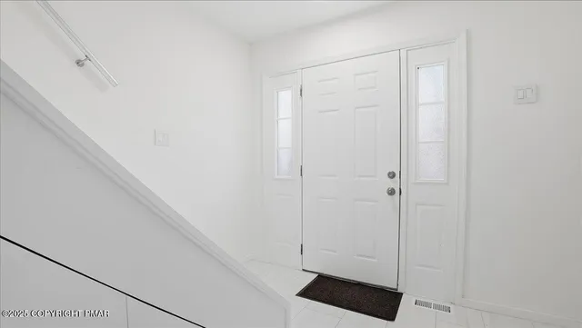 a backyard of a house with outdoor seating