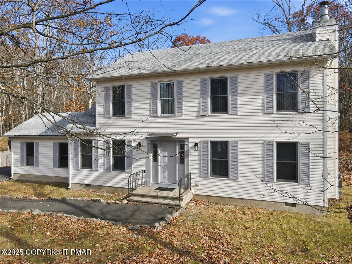 2312 Cramer Court Bushkill, PA 18324 - Photo 5 of 107 a view of a white house with large windows