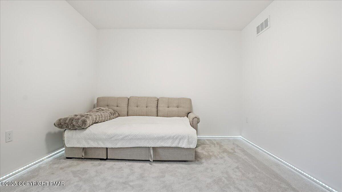 2312 Cramer Court Bushkill, PA 18324 - Photo 59 of 107 a room with a bed and a night stand