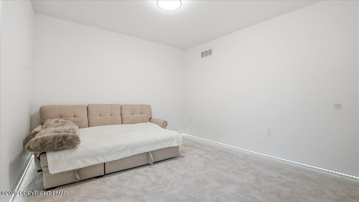 2312 Cramer Court Bushkill, PA 18324 - Photo 60 of 107 a room with a bed and a night stand