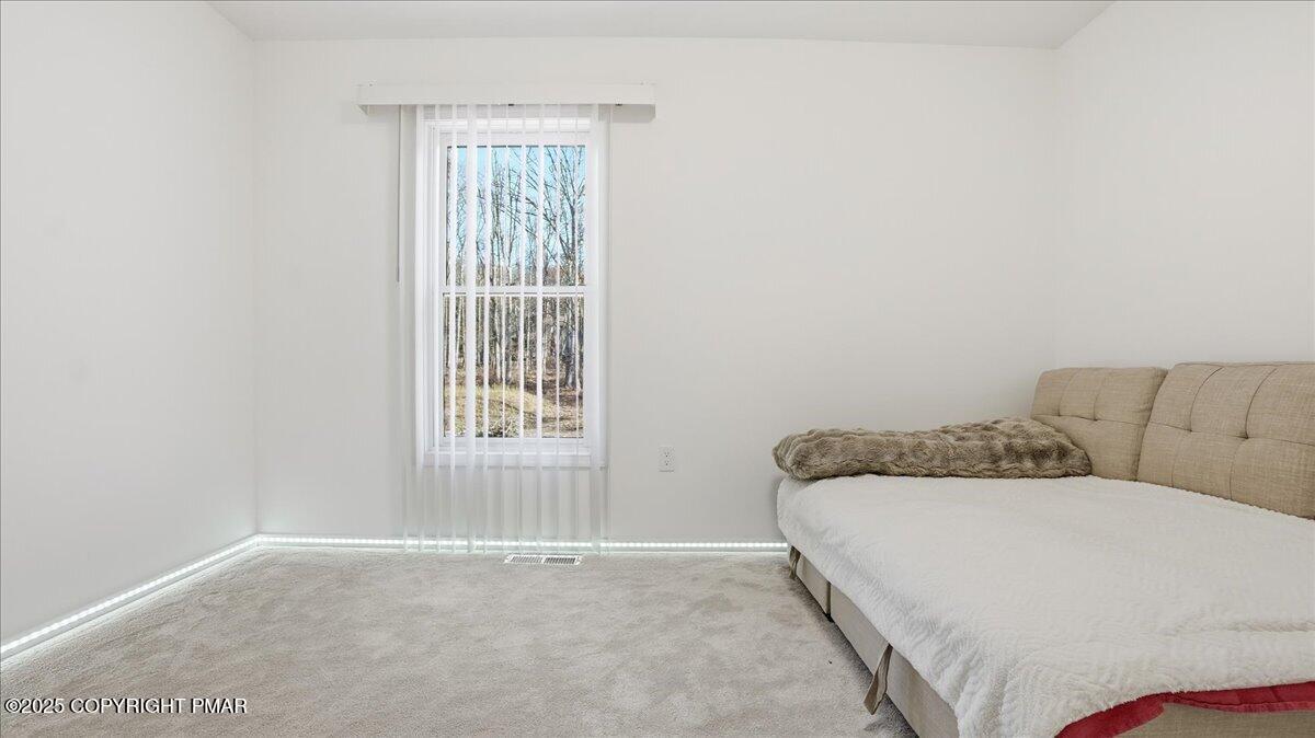2312 Cramer Court Bushkill, PA 18324 - Photo 61 of 107 a bedroom with a bed and a window