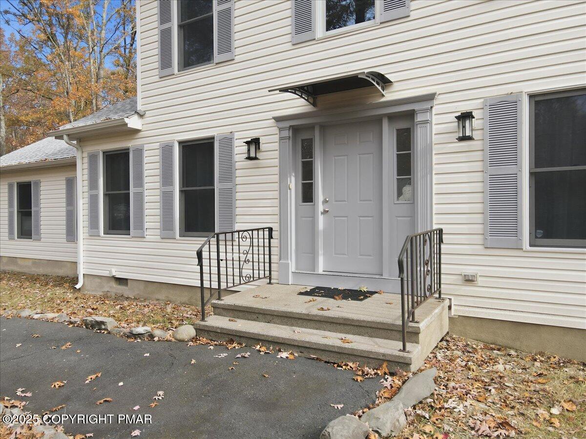 2312 Cramer Court Bushkill, PA 18324 - Photo 9 of 107 a front view of a house with a fence