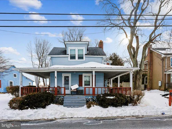 a front view of a building with garden