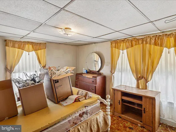 a view of a room with furniture and a window