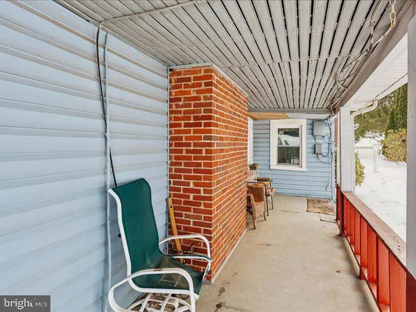 a view of a balcony with chairs