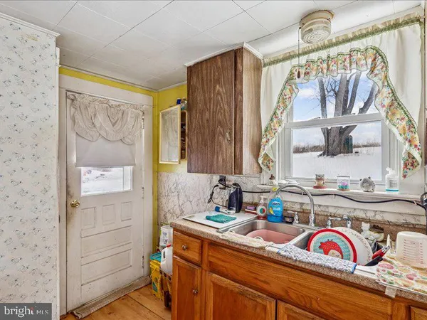 a bathroom with a sink a vanity and a mirror
