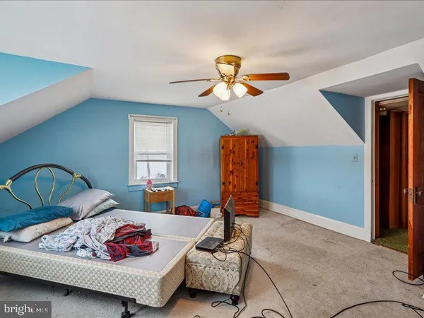 a bedroom with furniture and window