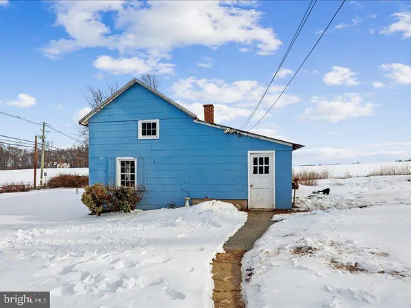 a view of a backyard of the house