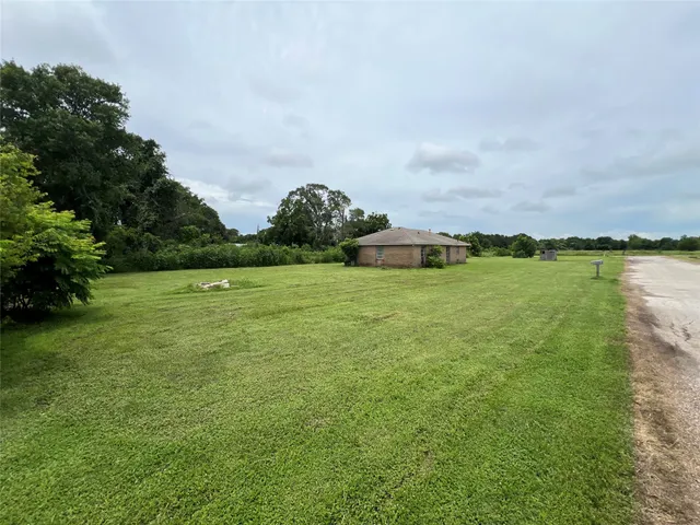 a view of a lake with houses in the back