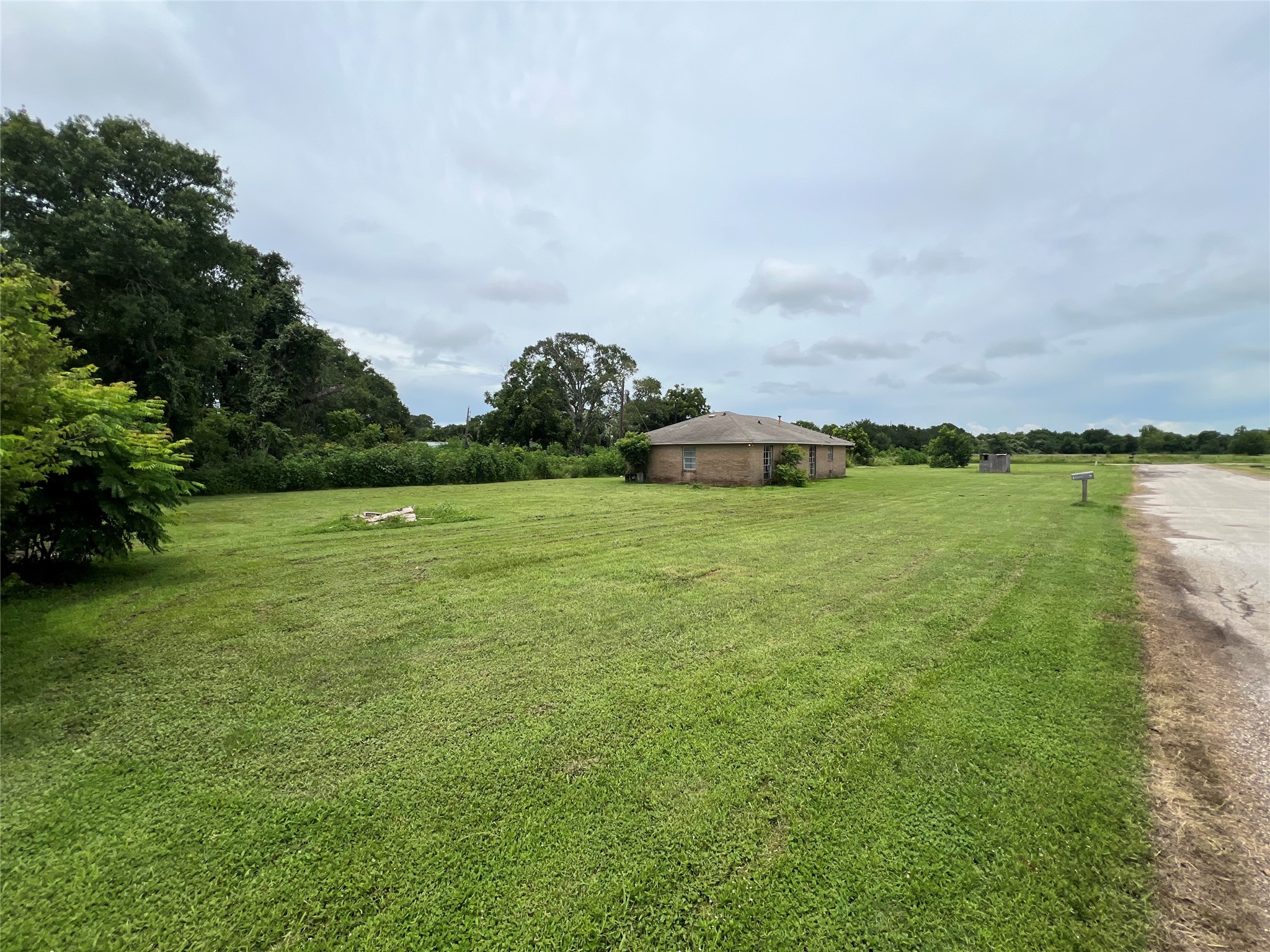 211 Payne Lane Richmond, TX 77469 - Photo 2 of 6 a view of a lake with houses in the back