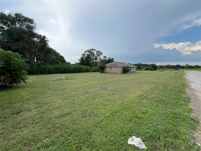 a view of a lake with houses in background