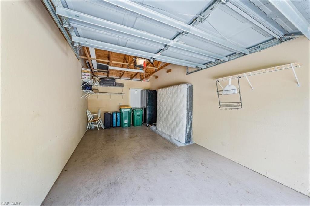 6914 Satinleaf Road North, Unit 103 Naples, FL 34109 - Photo 26 of 34 a view of hallway with stairs