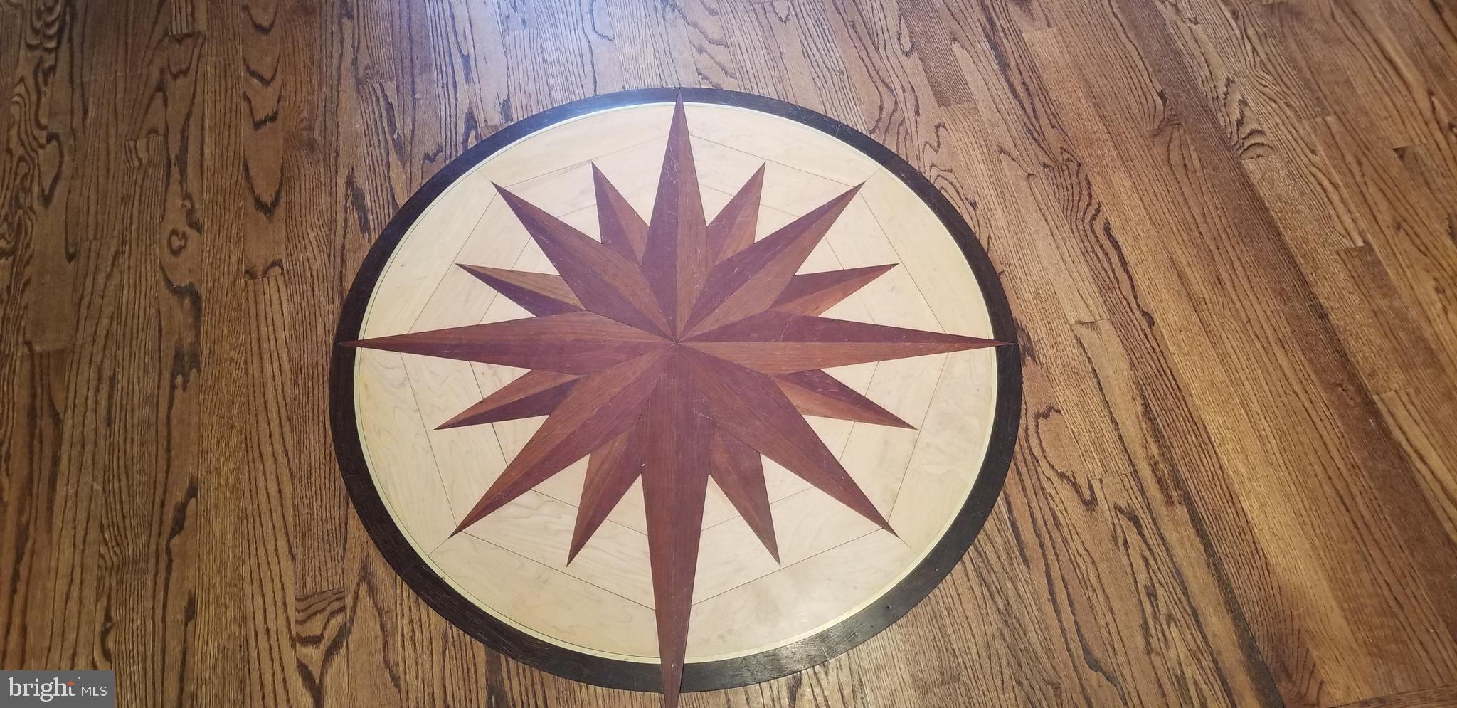1717 Thornton Ridge Road Towson, MD 21204 - Photo 5 of 49 Compass rose and hardwood floors with walnut inlay
