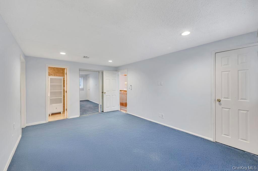 64 Fox Place Hicksville, NY 11801 - Photo 14 of 25 Spare room with recessed lighting, carpet flooring, and a textured ceiling