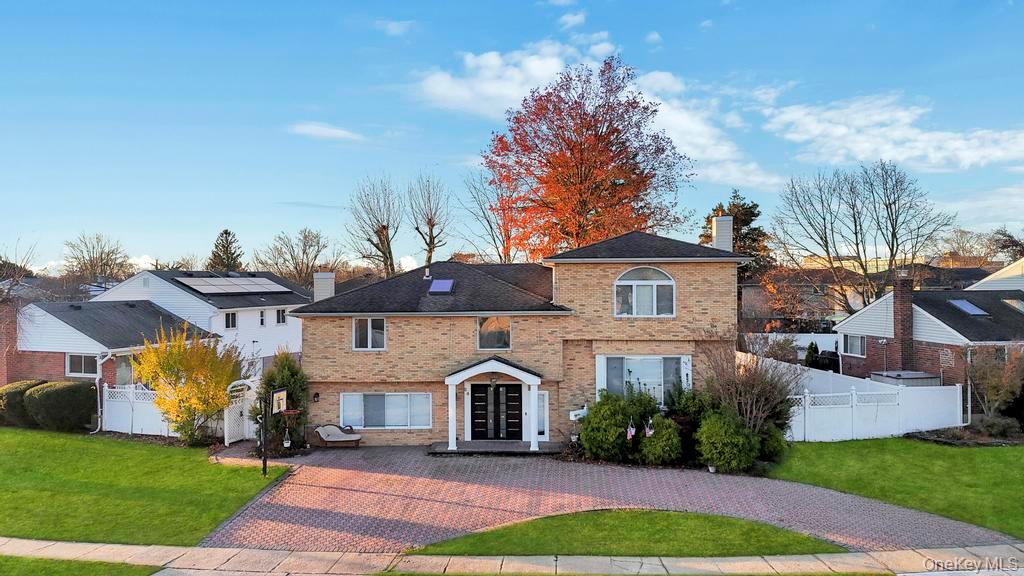 64 Fox Place Hicksville, NY 11801 - Photo 23 of 25 View of front of home featuring a chimney and brick siding