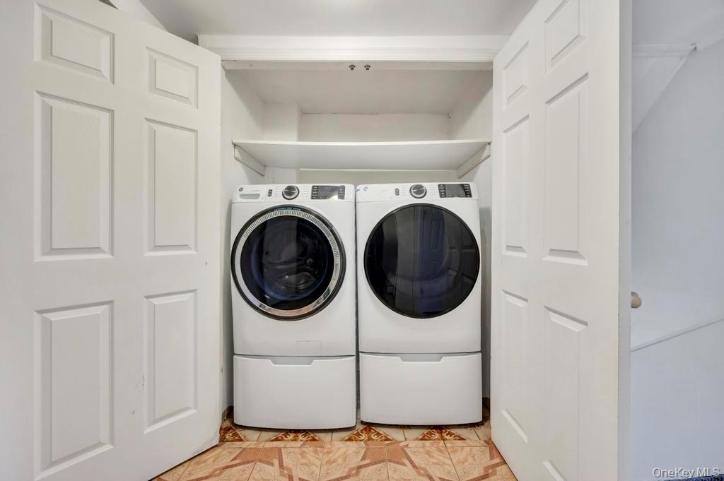 64 Fox Place Hicksville, NY 11801 - Photo 25 of 25 Laundry room featuring separate washer and dryer