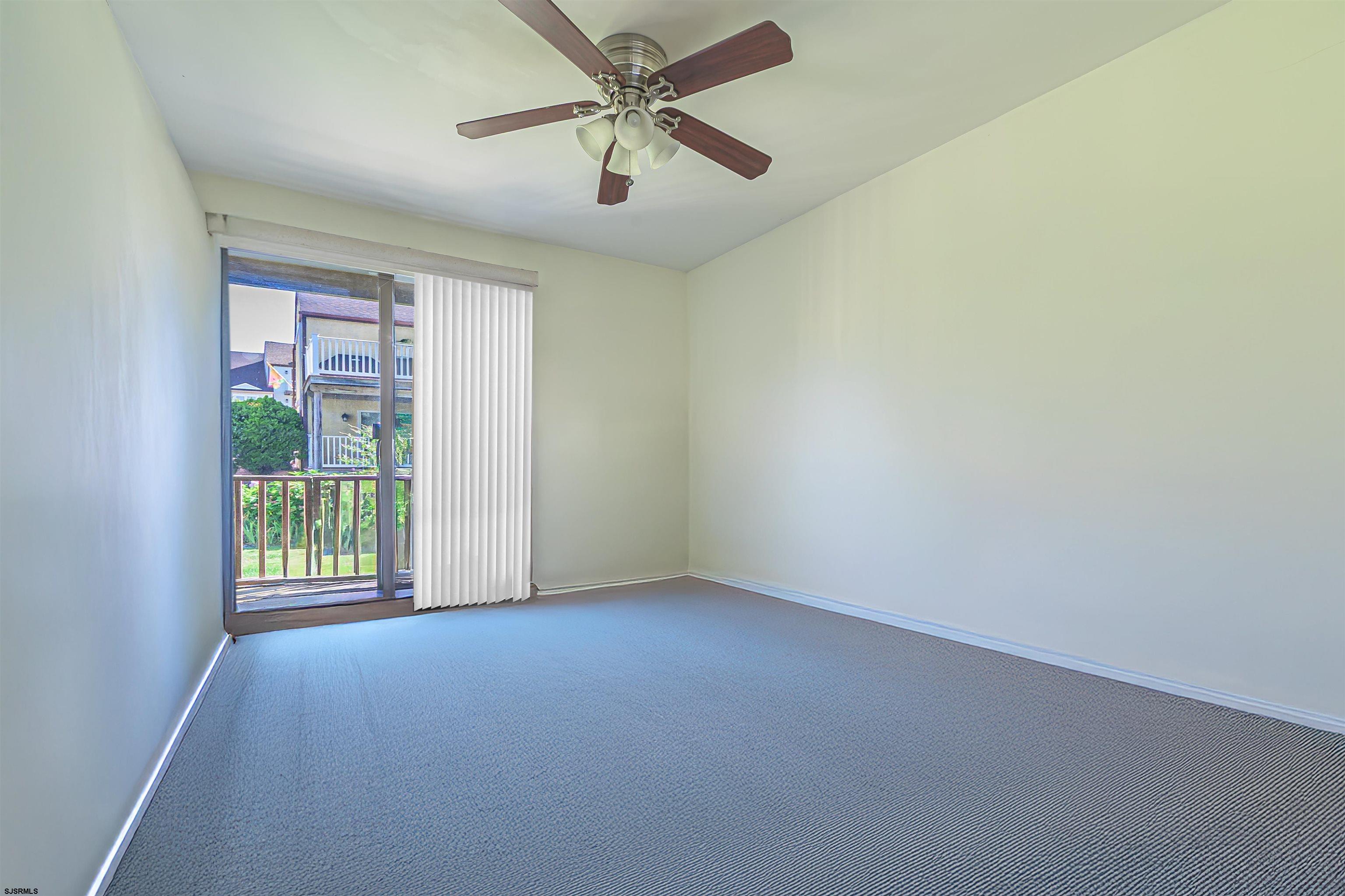 19 Bramble Drive Brigantine, NJ 08203 - Photo 13 of 15 an empty room with windows and fan