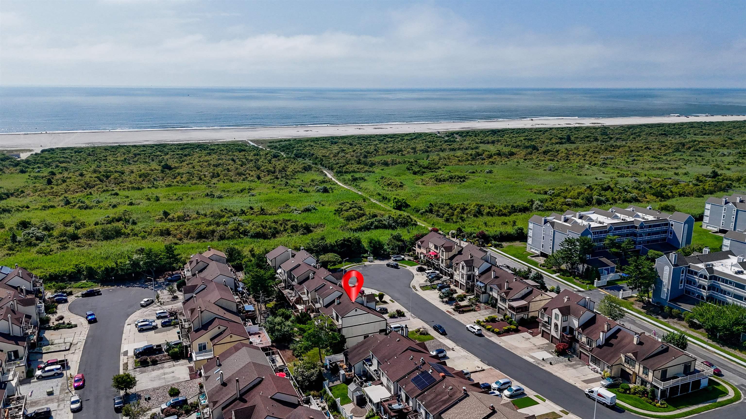 19 Bramble Drive Brigantine, NJ 08203 - Photo 3 of 15 a view of a yard with an ocean view