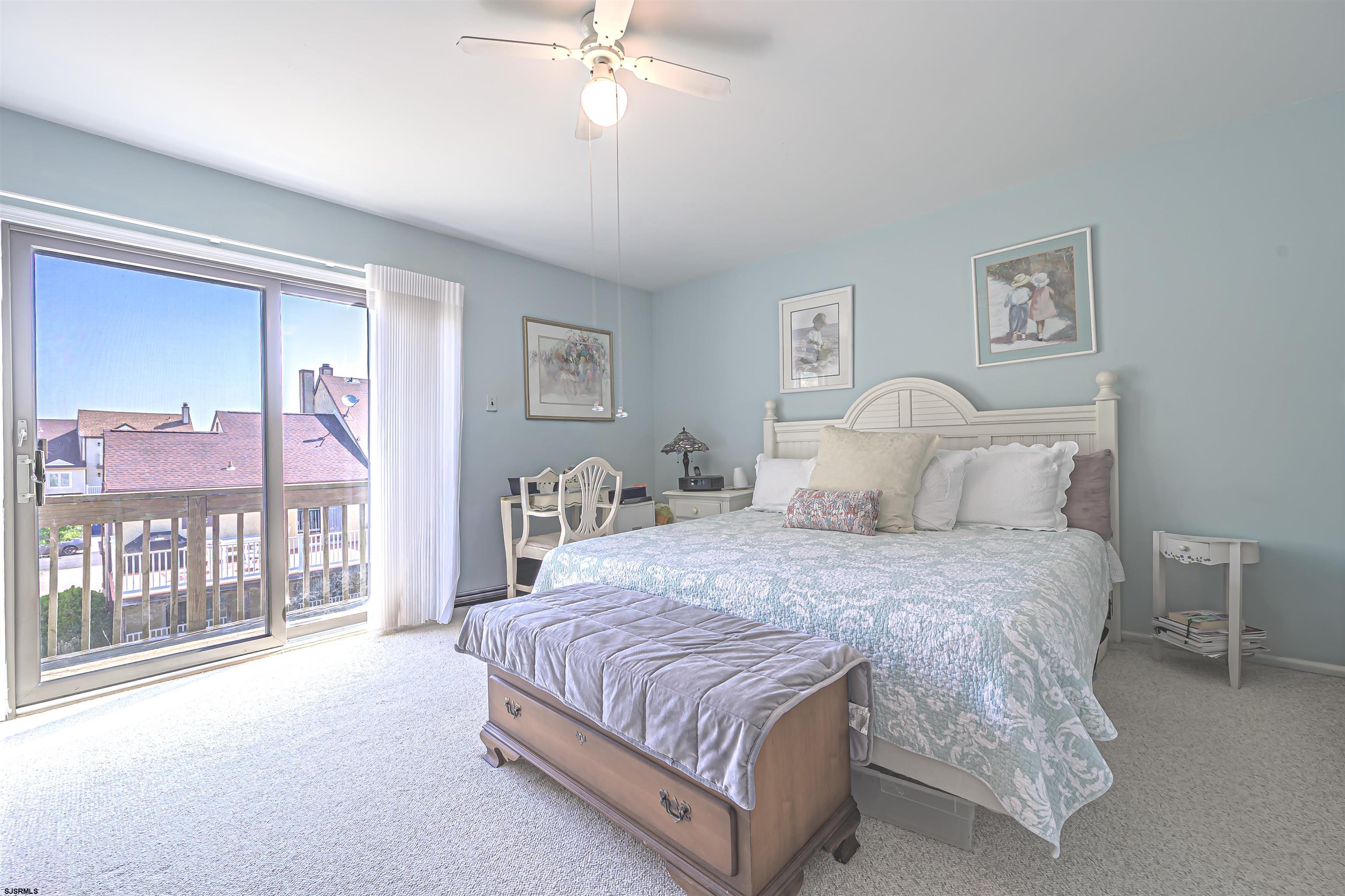 19 Bramble Drive Brigantine, NJ 08203 - Photo 6 of 15 a bedroom with a large bed and a chandelier