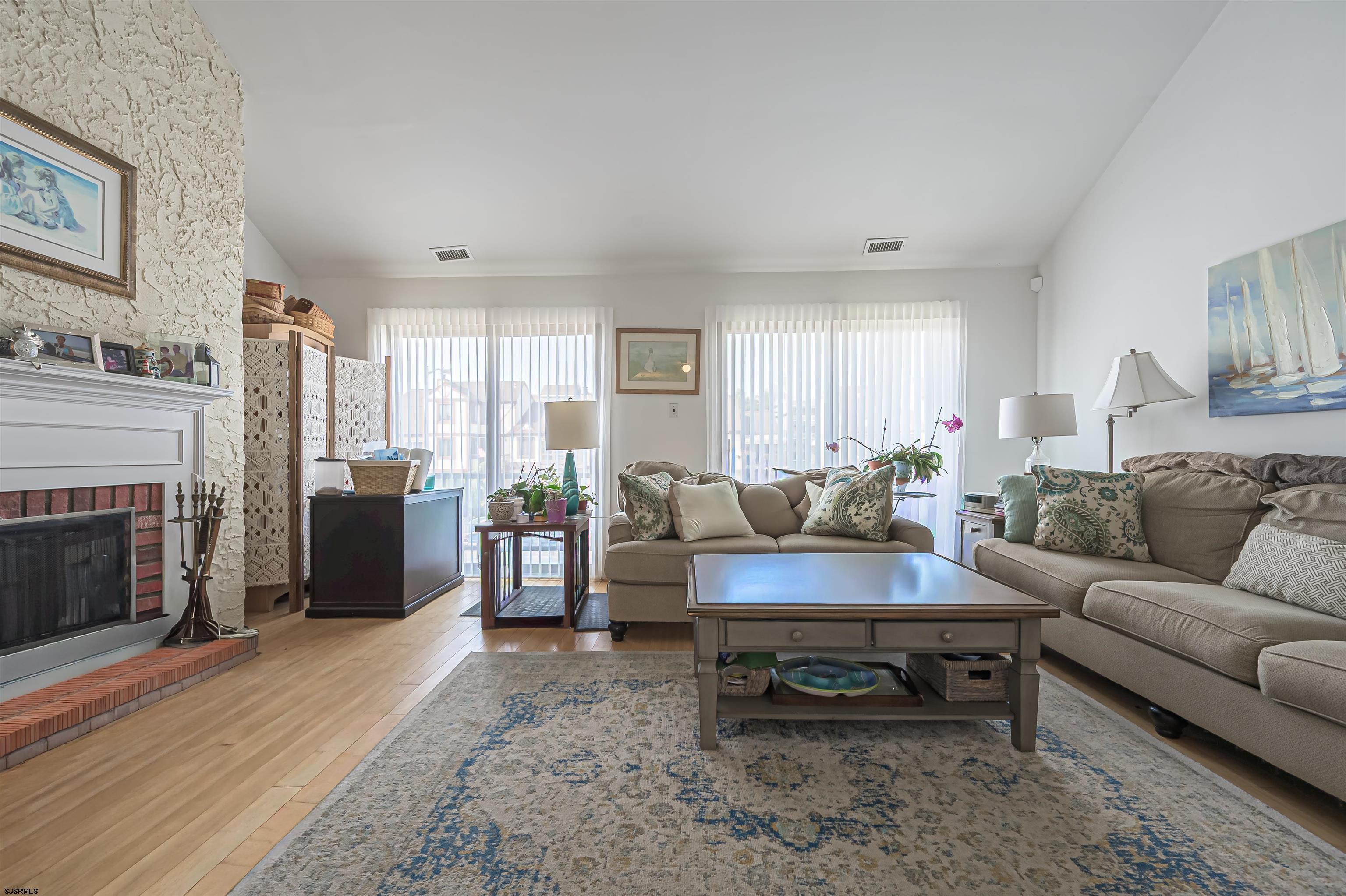 19 Bramble Drive Brigantine, NJ 08203 - Photo 8 of 15 a living room with furniture and a fireplace