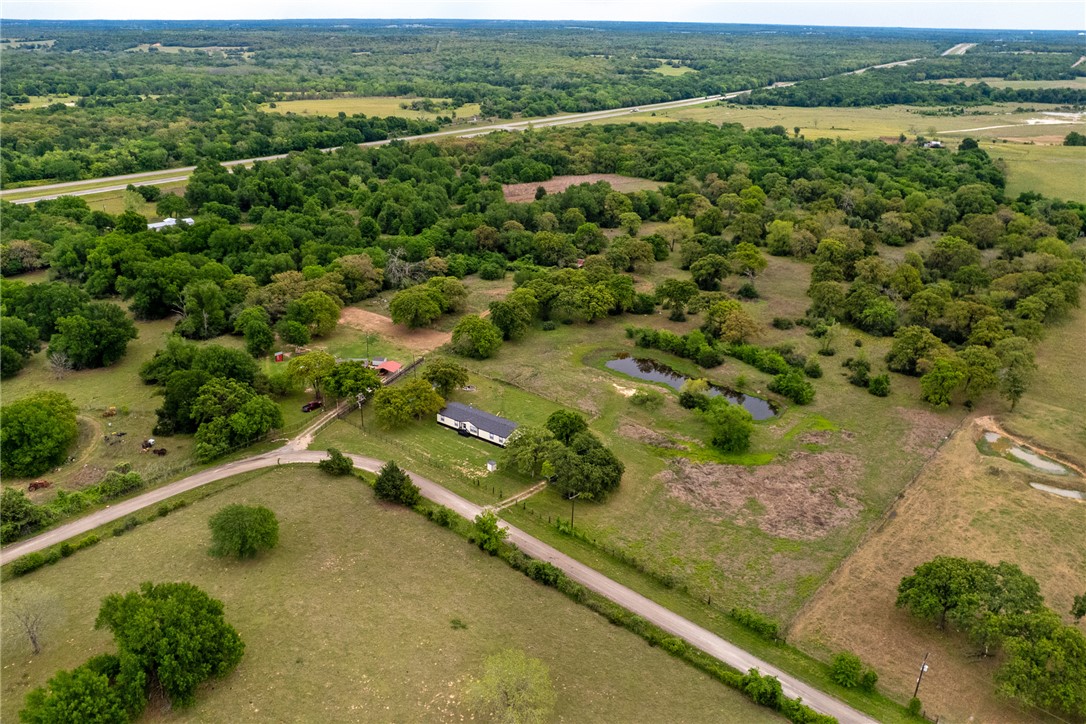 11459 Winstead Lane Calvert, TX 77837 - Photo 35 of 37 an aerial view of residential houses with outdoor space and trees