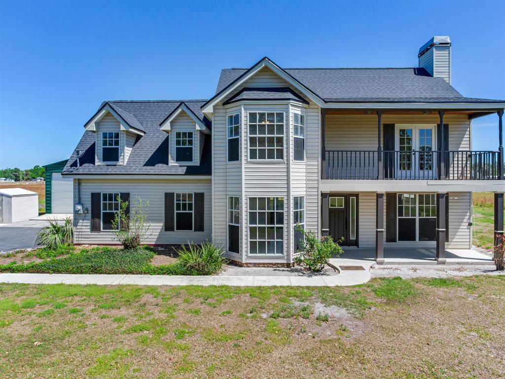 3434 East Keysville Road Lithia, FL 33547 - Photo 1 of 1 front view of a house with a yard