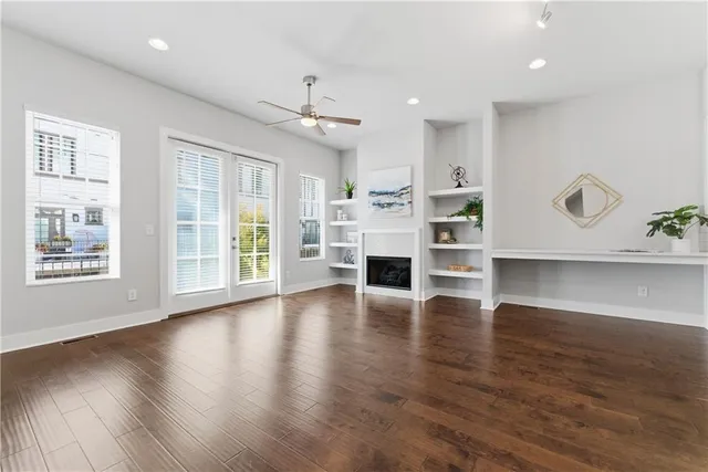 a view of kitchen with stove and wooden floor