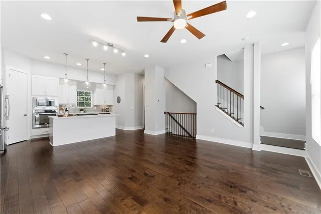 a view of kitchen with cabinets and wooden floor